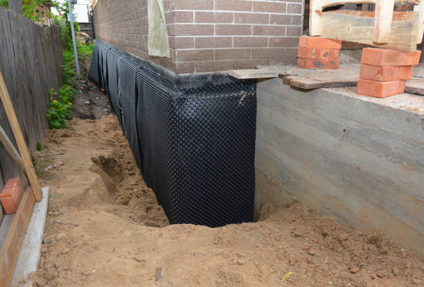 Happy homeowners after waterproofing job in Redgranite